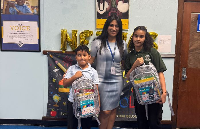  Students with backpacks and Principal